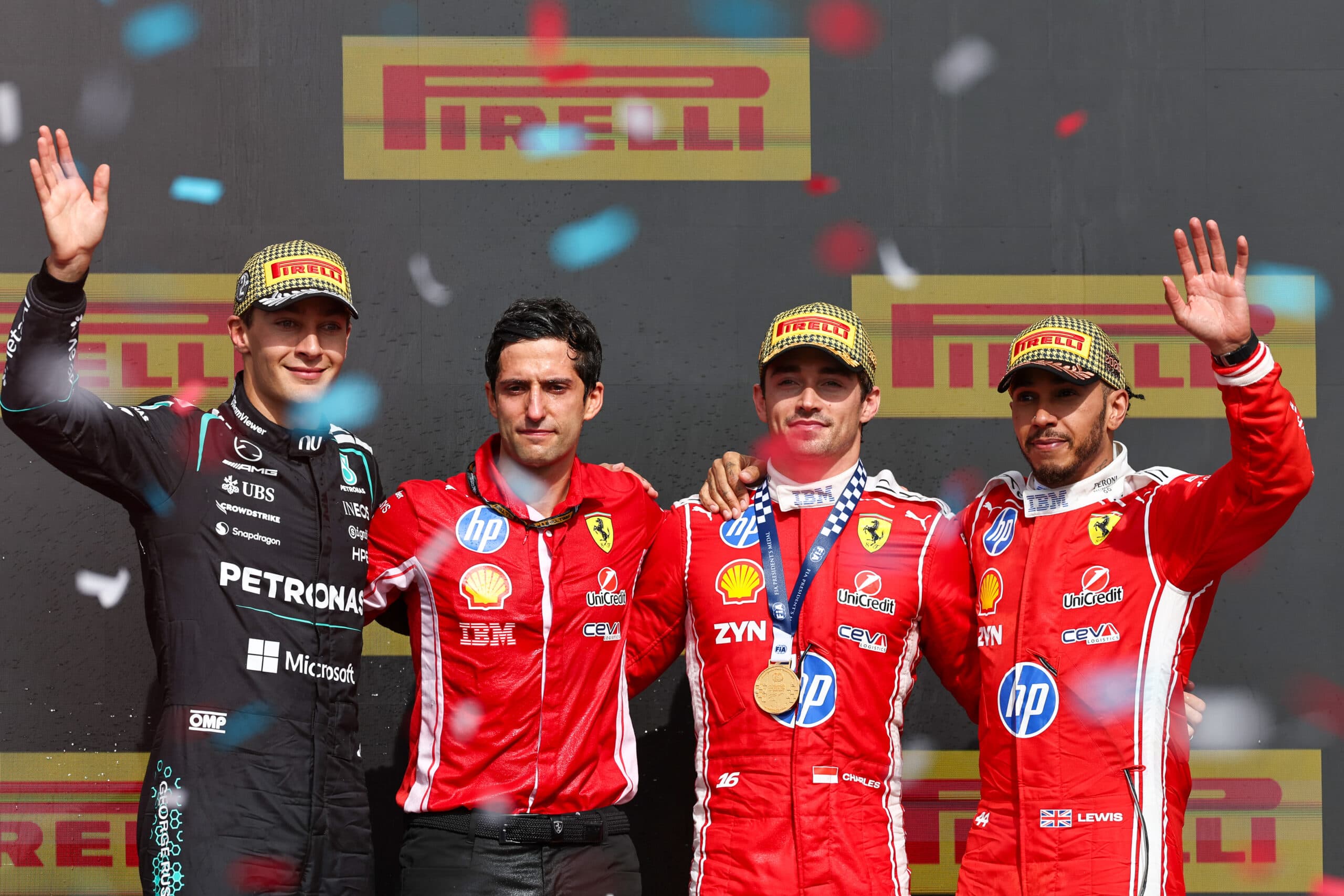 London: Ferrari's Charles Leclerc (2nd R) of Monaco, Mercedes' British driver George Russell (1st L), Ferrari's British driver Lewis Hamilton (1st R) and Ferrari's race engineer Bryan Bozzi pose for photos on the podium after the Formula One British Grand Prix at the Silverstone Circuit in Silverstone, Britain, July 5, 2026. (Photo: Xinhua via IANS)