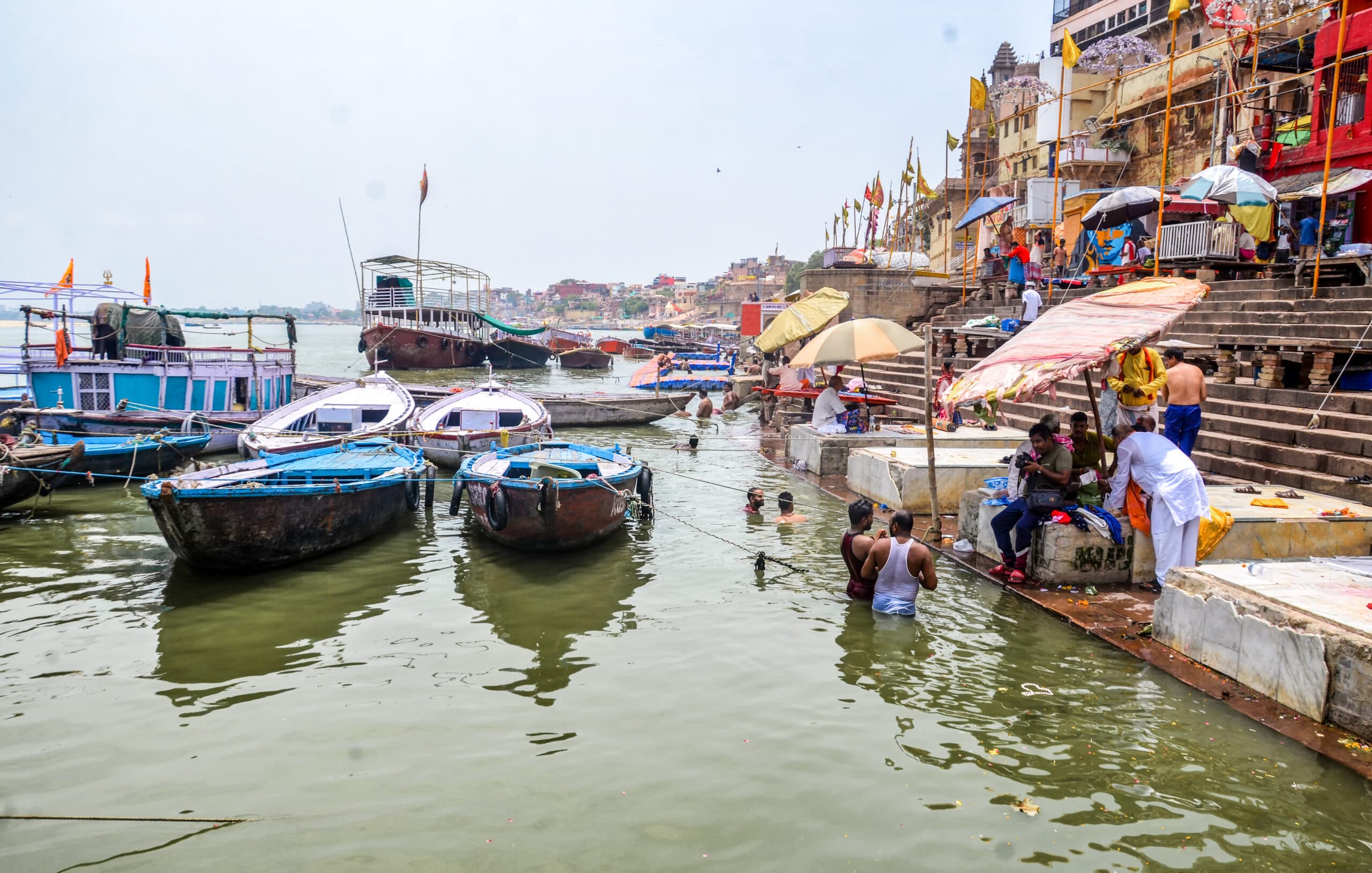 Varanasi: People gather along the ghats as the Ganga river continues to rise at a rate of around 3 cm per hour, in Varanasi on Wednesday, July 15, 2026. (Photo: IANS)
