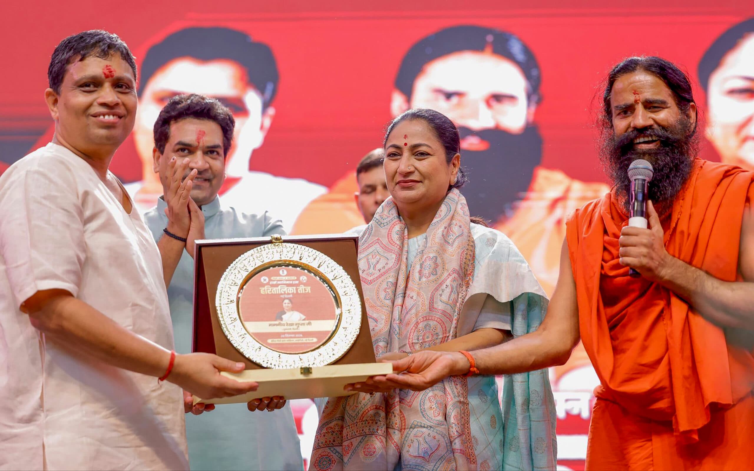 New Delhi: Delhi Chief Minister Rekha Gupta clicks a selfie with women during the Haritalika Teej Mahotsav 2026, in New Delhi, on Sunday, September 20, 2026. (Photo: IANS/X/@gupta_rekha)