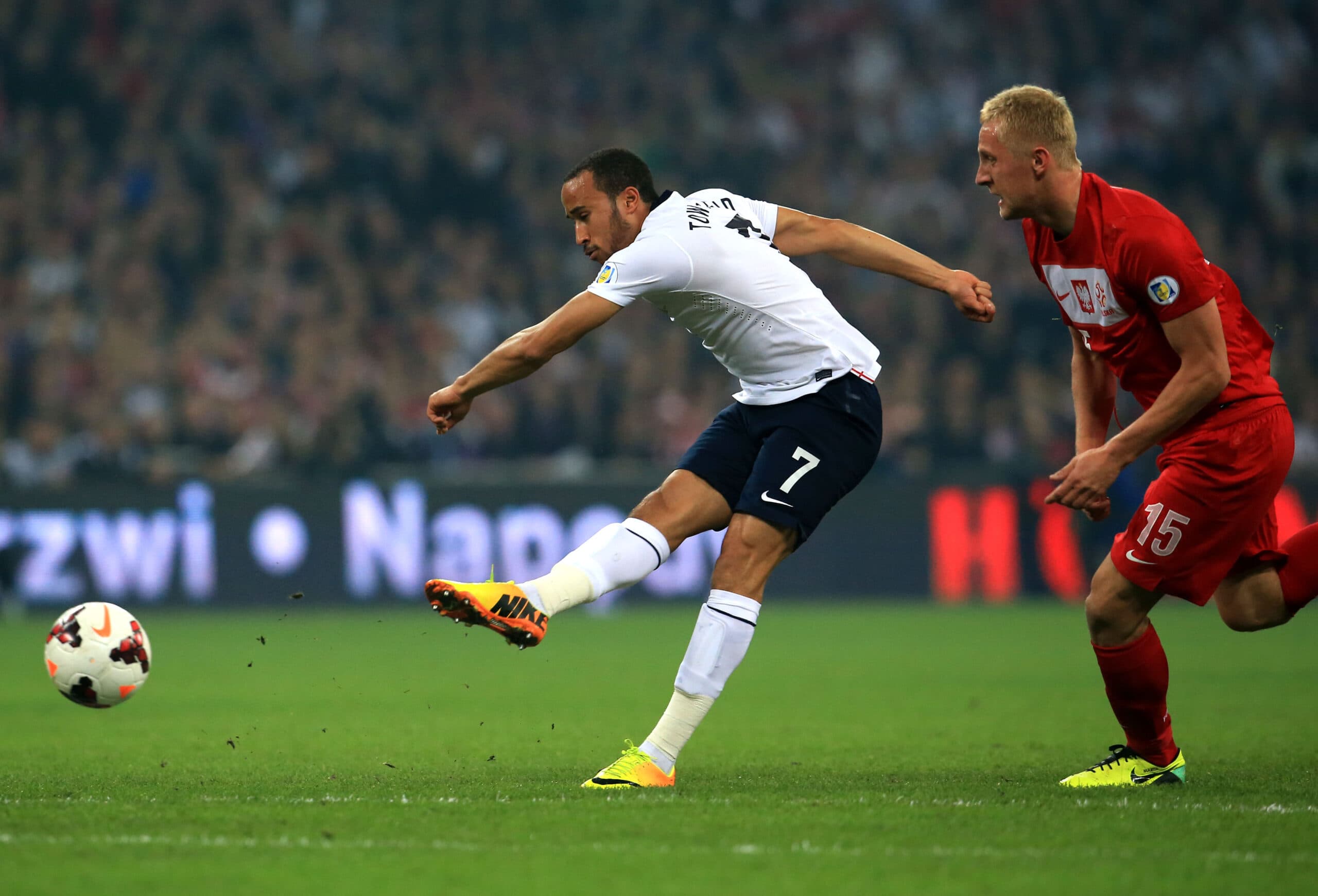 (131016) -- LONDON, Oct. 16, 2013 (Xinhua) -- Andros Townsend (L) of England shoots during the 2014 World Cup Qualifiers match against Poland in London, England, on Oct.15, 2013. England won 2-0 and qualified to the 2014 FIFA World Cup in Brazil. (Xinhua/Yin Gang)