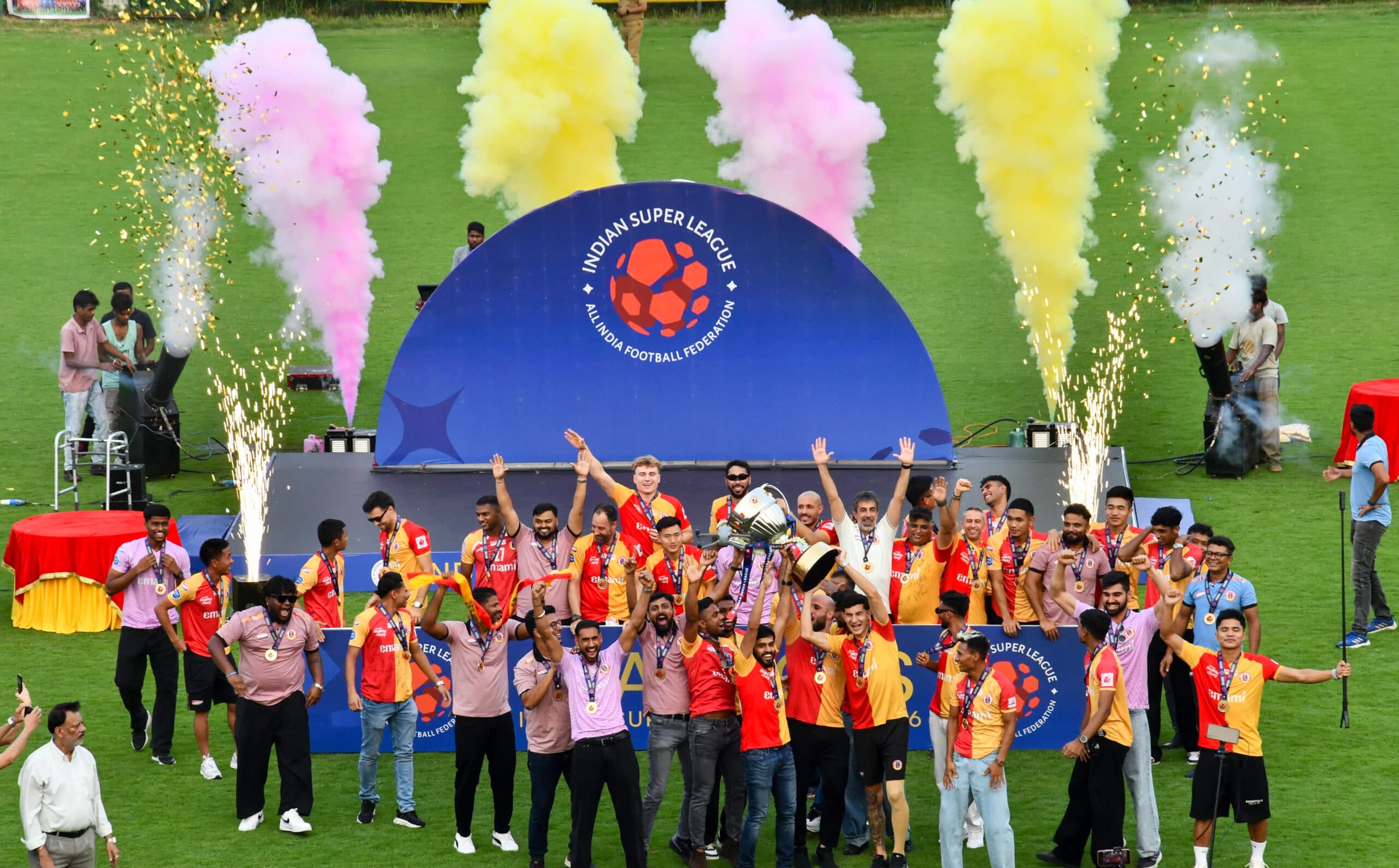 Kolkata: East Bengal players, officials and members celebrate the club’s maiden Indian Super League (ISL) title with the trophy at the East Bengal Club tent, in Kolkata on Friday, May 22, 2026. (Photo: IANS/Kuntal Chakrabarty)