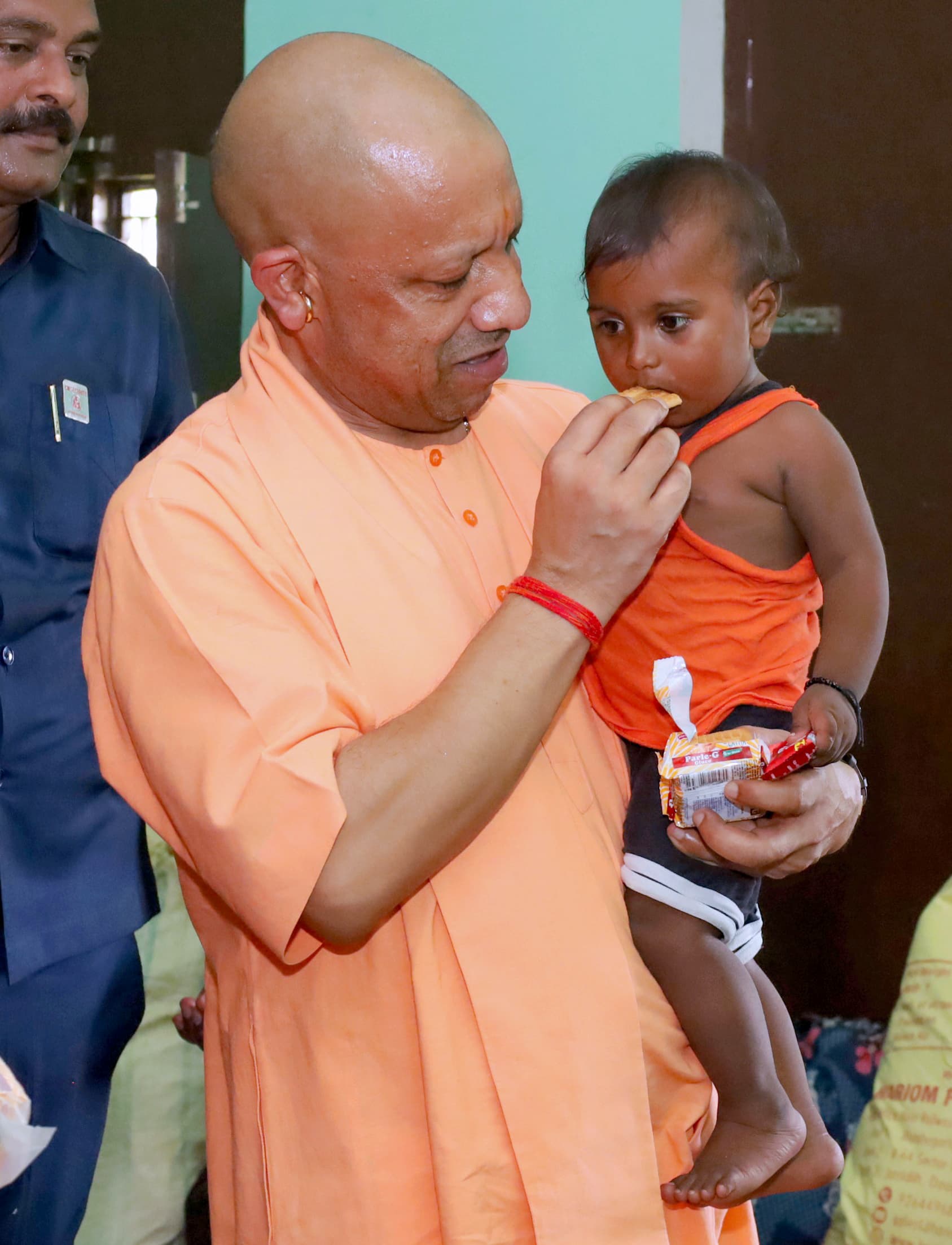 Kushinagar: Uttar Pradesh Chief Minister Yogi Adityanath interacts with a child during his visit to a flood-affected area in Kushinagar district of Uttar Pradesh on Tuesday, September 29, 2026. (Photo: IANS/X/@myogiadityanath)