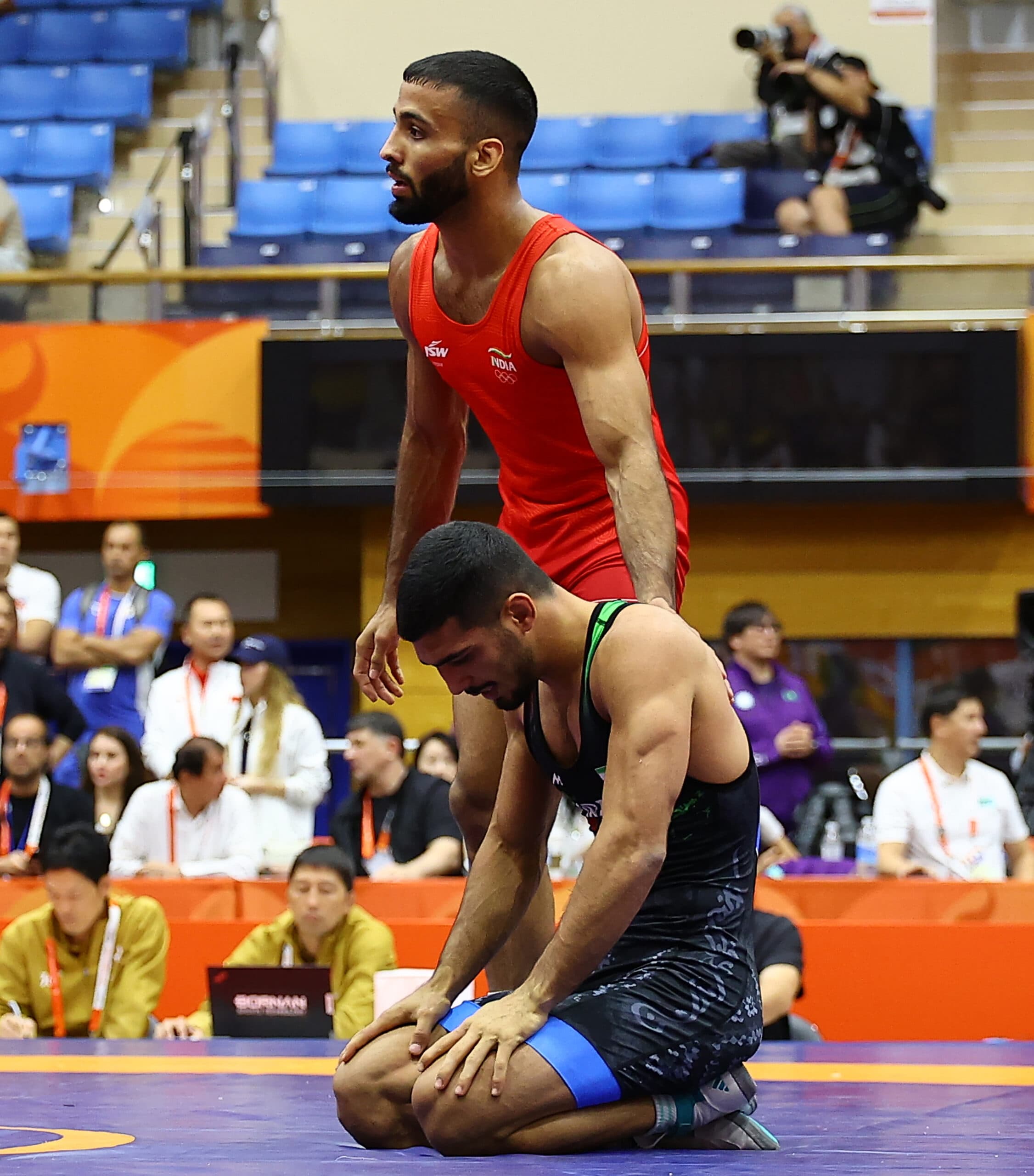 Nagoya: India's Sujeet Kalkal and Iran's Abbas Ebrahimzadehsavadkouhi during the men's freestyle 65kg quarterfinal at the Asian Games in Nagoya, Japan, on Friday, October 2, 2026. (Photo: IANS)