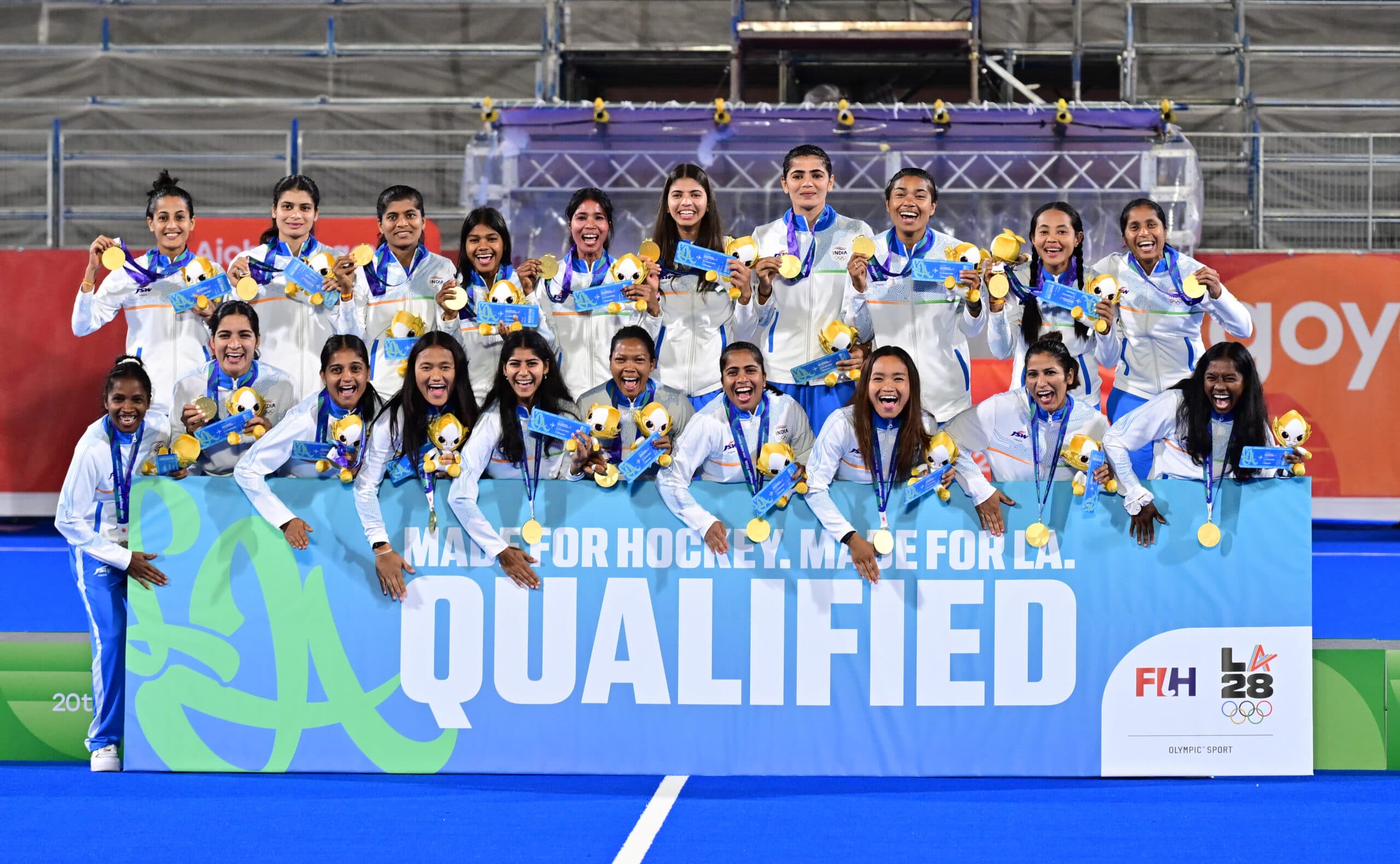 Kakamigahara: Gold medalists India celebrate on the podium holding a board stating their qualification to the LA olympics, during the medal ceremony after the women's hockey finals at the Asian Games in Gifu, Japan, Friday, Oct. 2, 2026. (Photo: IANS/Biplab Banerjee)