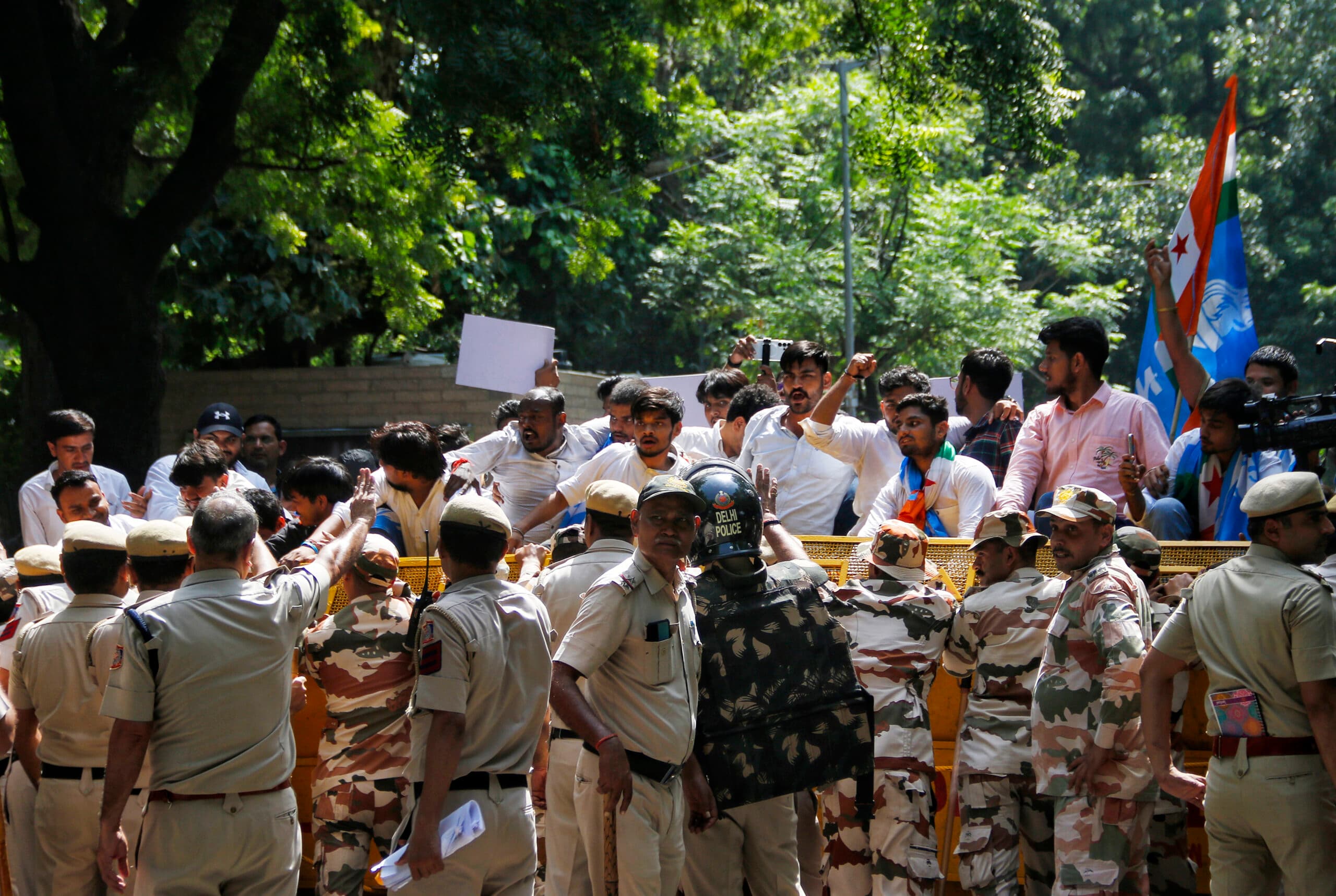 New Delhi: Protesters raise slogans as Delhi Police and paramilitary personnel stand behind barricades during a protest demanding the resignation of Chief Election Commissioner Gyanesh Kumar and opposing the Special Intensive Revision (SIR) of electoral rolls, in New Delhi on Friday, October 2, 2026. (Photo: IANS/Wasim Sarvar)