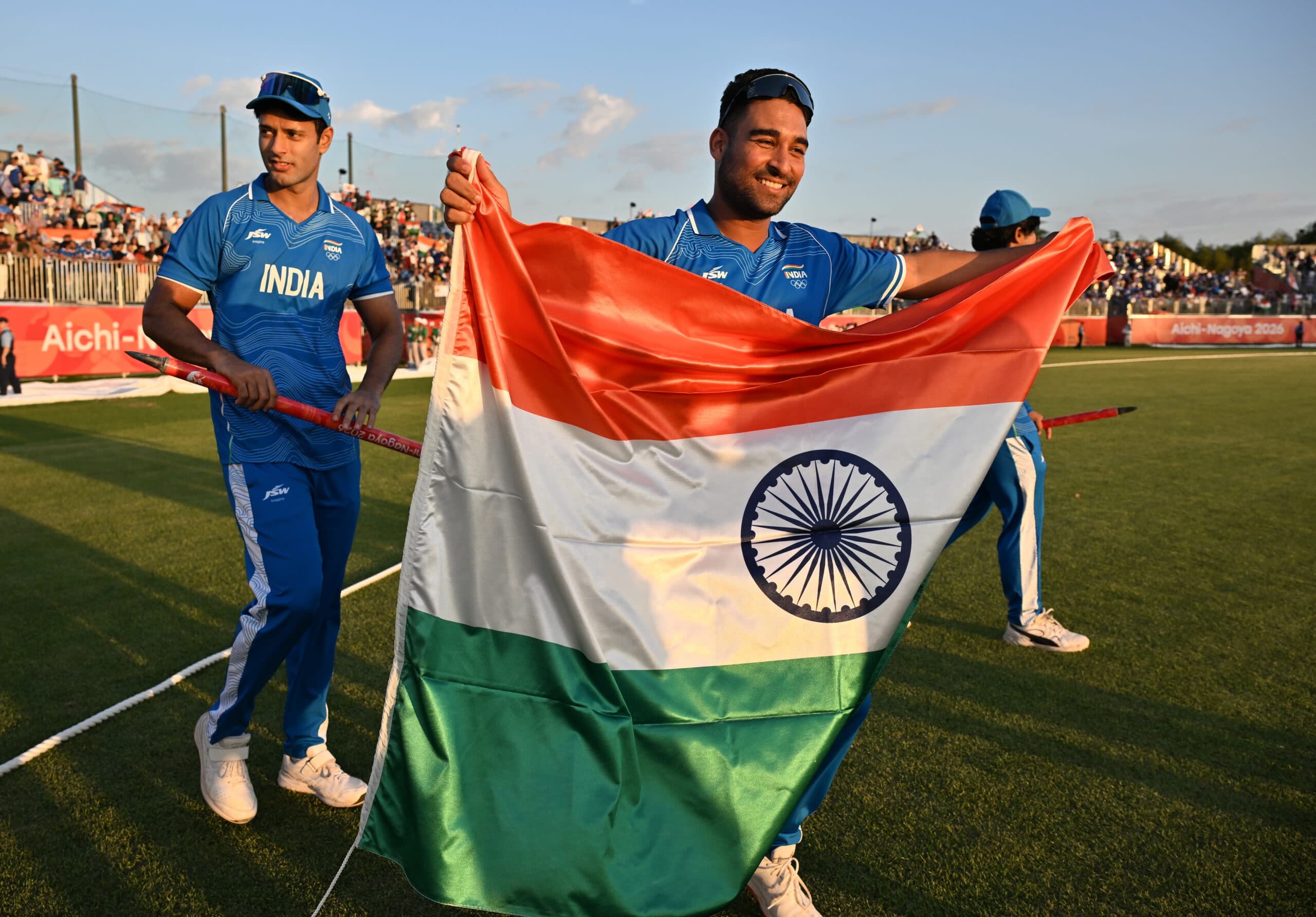 Nisshin: India's Vipraj Nigam celebrates with the National Flag after winning the gold medal in the men's T20I cricket final against Pakistan at the Asian Games 2026, at Korogi Sports Park in Nisshin, Japan, on Saturday, October 3, 2026. (Photo: IANS/Biplab Banerjee)