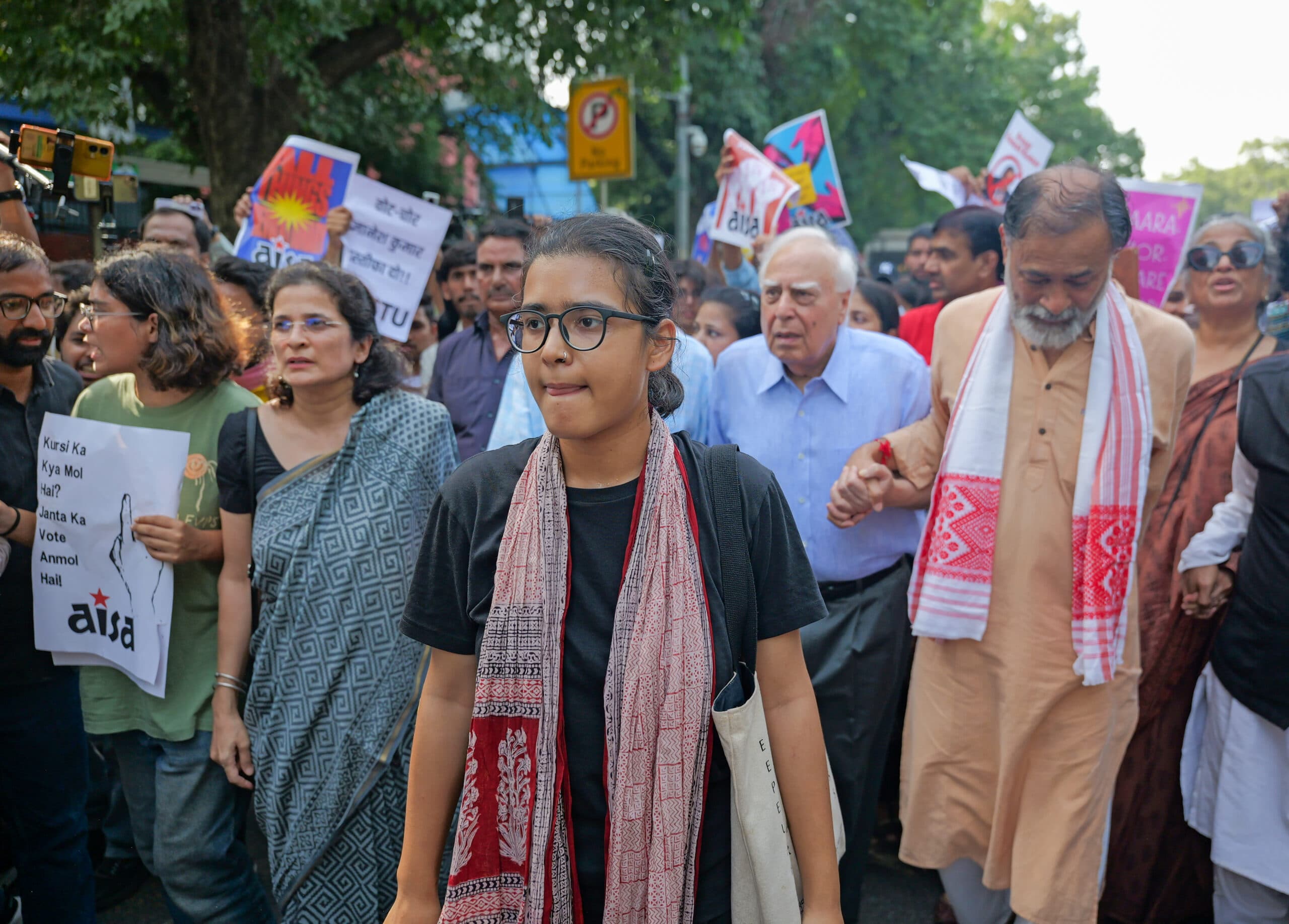 New Delhi: Social activist Yogendra Yadav and senior advocate Kapil Sibal, along with All India Students' Association (AISA) National President Neha Bora, and other protesters, march towards Jantar Mantar during a protest against Chief Election Commissioner (CEC) Gyanesh Kumar, demanding his resignation over the alleged irregularities in the Special Intensive Revision (SIR) of electoral rolls and mass deletion of voters, at Jantar Mantar, in New Delhi, Saturday, Oct. 3, 2026. (Photo: IANS/Deepak Kumar)