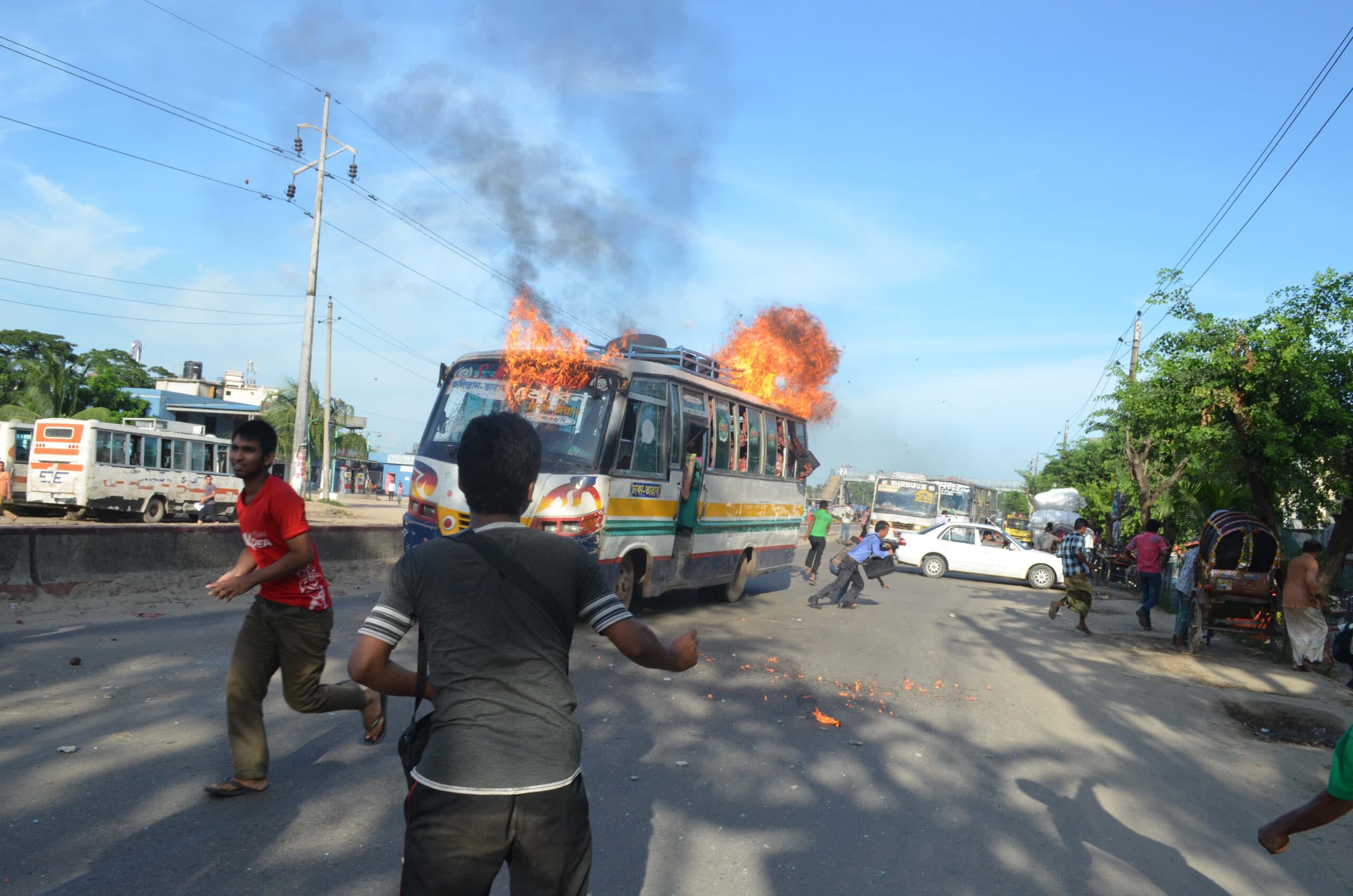 (130716) -- DHAKA, July 16, 2013 (Xinhua) -- A bus is set on fire by activists of Bangladesh Jamaat-e-Islmai party is seen in Dhaka, Bangladesh, July 15, 2013. At least five people were dead and scores others including cops injured Monday in stray incidents of violence during Bangladesh's largest Islamic party enforced countrywide dawn-to-dusk hartal protesting a war crimes verdict against one of its most high profile leaders, sources said. Ghulam Azam, former chief of Jamaat, was sentenced to 90 years in prison for war crimes including mass killings.  (Xinhua) (srb)