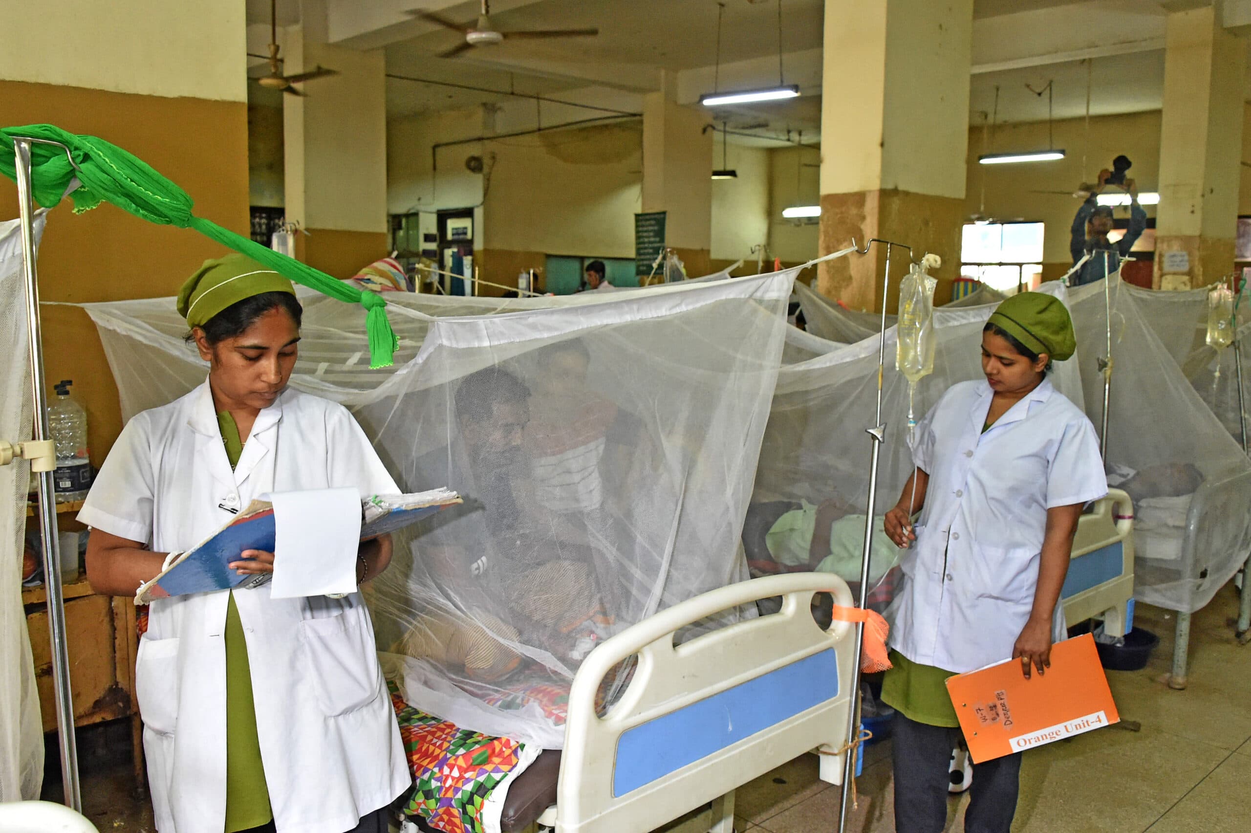 DHAKA, July 24, 2019 (Xinhua) -- Medical workers check on dengue patients at a hospital in Dhaka, Bangladesh, on July 24, 2019. A total of 5,050 fresh cases of dengue were reported from Bangladesh capital Dhaka and elsewhere on the outskirts of the city so far this month, bringing the total number of confirmed cases till July 23 in the country to 7,179. (Str/Xinhua/IANS)